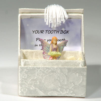 Tandbox med en fe som hller i tanden
